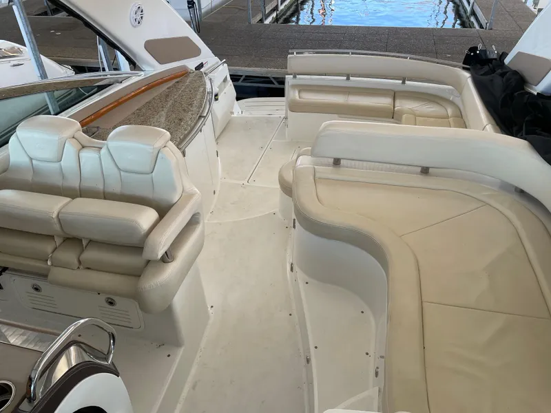 Slide: The Image of Luxurious seating area on a 2008 Cobalt 46 yacht with cream upholstery. - 13