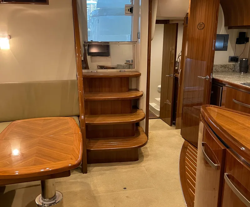 Slide: The Image of Luxurious interior of 2008 Cobalt 46 yacht with wooden finishes and modern amenities. - 18