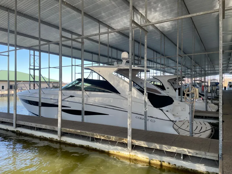 Slide: The Image of 2008 Cobalt 46 yacht docked in covered marina. - 2