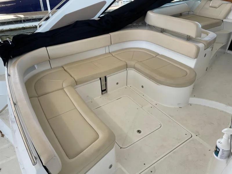 Slide: The Image of 2008 Cobalt 46 yacht with beige leather seating in a spacious deck area. - 5