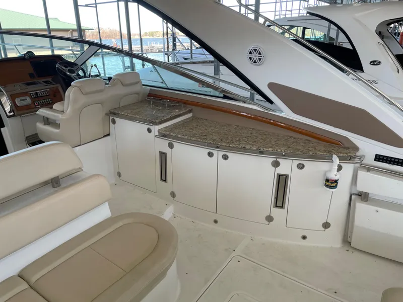 Slide: The Image of 2008 Cobalt 46 yacht interior with seating and helm, featuring elegant design and spacious layout. - 6