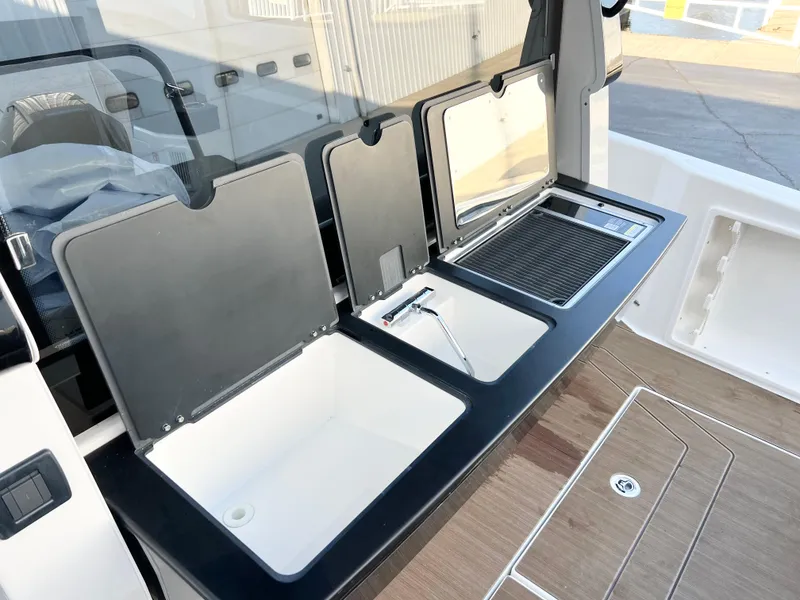 Slide: The Image of Outdoor kitchen setup on 2025 Navan C30 boat with sink and grill. - 14