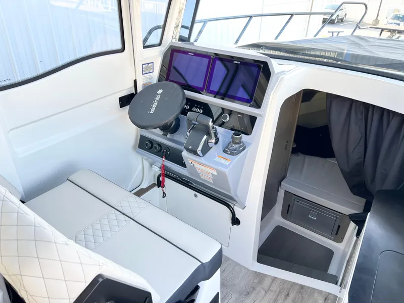 Slide: The Image of Interior of 2025 Navan C30 boat with modern dashboard and seating. - 16