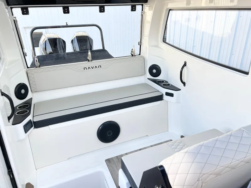 Slide: The Image of Interior of 2025 Navan C30 boat with seating, cup holders, and modern design. - 17