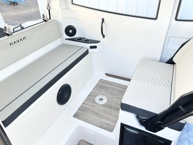 Slide: The Image of Interior of 2025 Navan C30 boat with seating, speakers, and cup holders. - 18