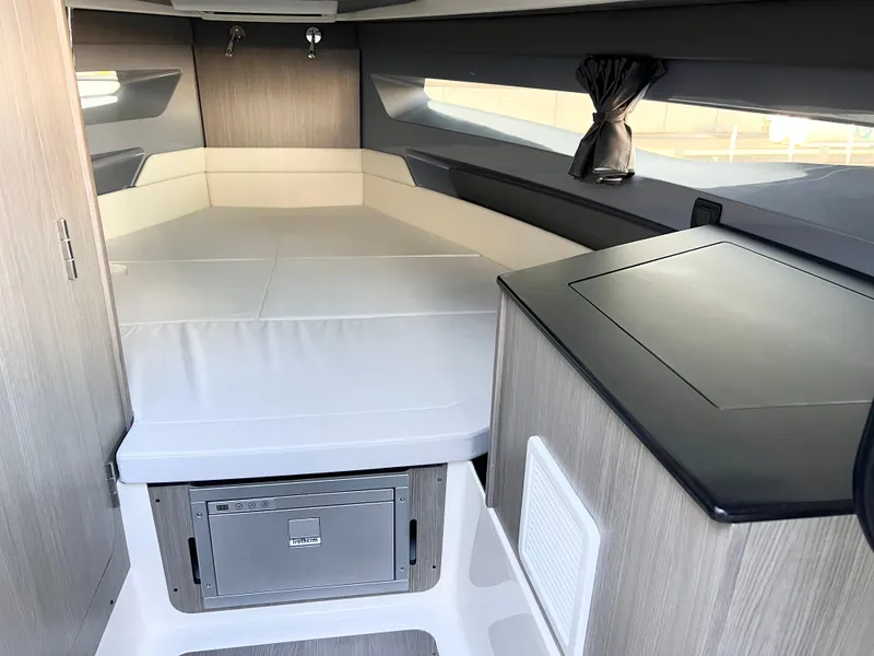 Slide: The Image of Interior of 2025 Navan C30 boat cabin with bed and storage. - 19