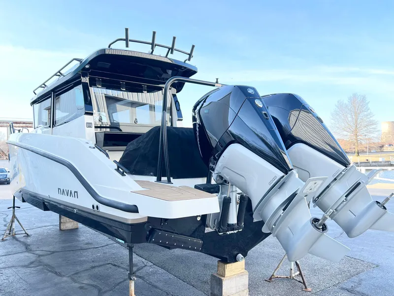 Slide: The Image of Navan C30 2025 boat with dual outboard motors on display, showcasing sleek design and modern features. - 2