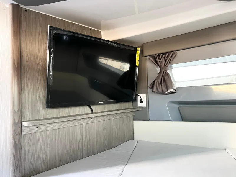 Slide: The Image of Interior of 2025 Navan C30 with mounted TV and modern furnishings. - 20
