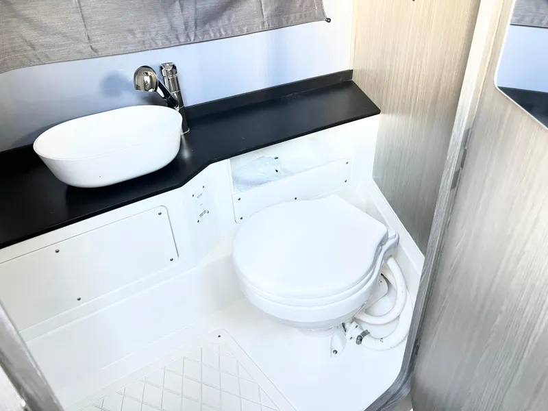 Slide: The Image of Modern bathroom in 2025 Navan C30 RV with sleek sink and compact toilet design. - 21