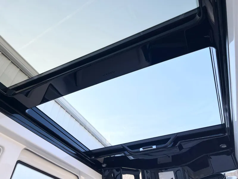 Slide: The Image of 2025 Navan C30 panoramic sunroof showcasing clear blue sky. - 23