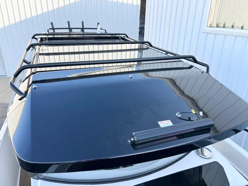 Slide: The Image of Roof rack on a 2025 Navan C30 vehicle, featuring a sleek black design. - 8