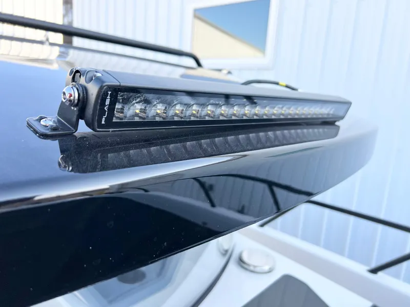 Slide: The Image of LED light bar on Navan C30, 2025 model, mounted on a sleek black surface. - 9