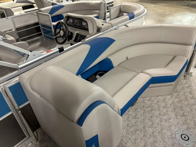 Slide: The Image of 2025 Trifecta 24 UL LE pontoon boat interior with beige and blue seating. - 3