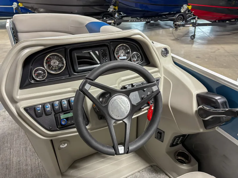 Slide: The Image of 2025 Trifecta 24 UL LE boat dashboard with steering wheel and control panel. - 7