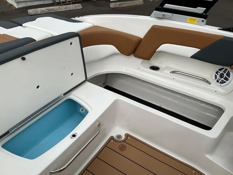 Slide: The Image of 2025 Chaparral 23 SSi boat interior with seating and storage compartments. - 17