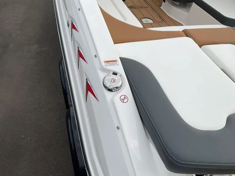 Slide: The Image of 2025 Chaparral 23 SSi boat interior with white and gray seating, red accents. - 22