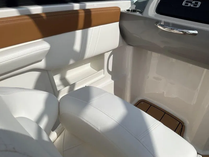 Slide: The Image of Interior of 2025 Chaparral 23 SSi boat with white and tan seating. - 34