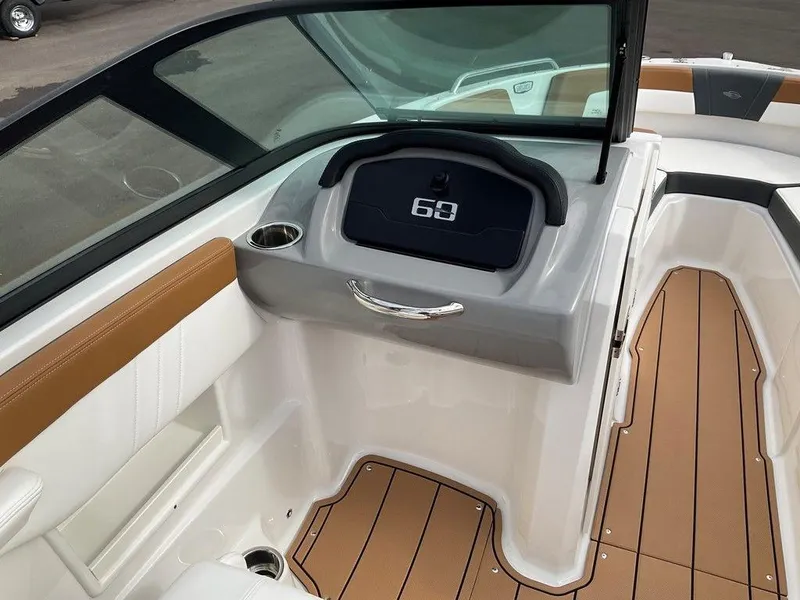 Slide: The Image of 2025 Chaparral 23 SSi boat interior with modern dashboard and sleek design. - 35