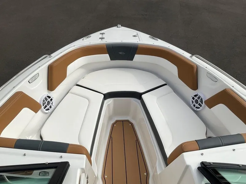 Slide: The Image of 2025 Chaparral 23 SSi boat interior with tan and white seating, modern design. - 40