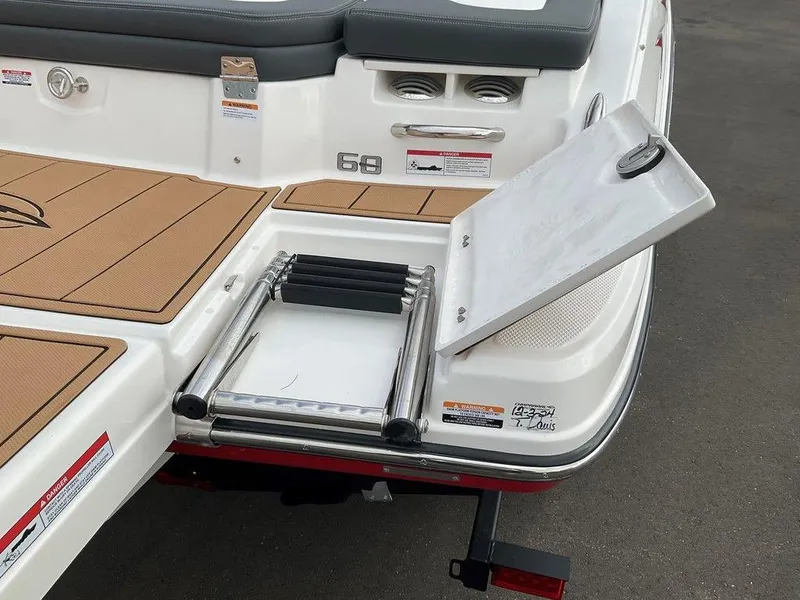 Slide: The Image of 2025 Chaparral 23 SSi boat with foldable swim ladder on deck. - 5