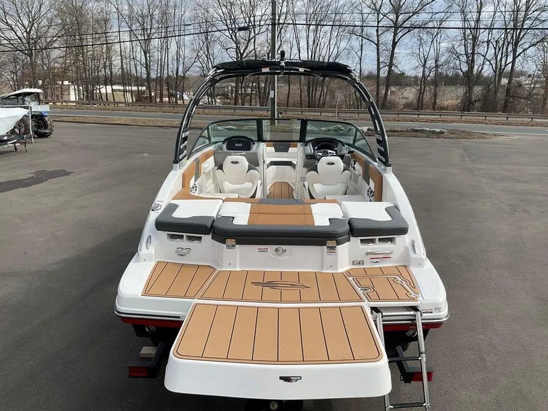 Slide: The Image of 2025 Chaparral 23 SSi boat, rear view, showcasing spacious deck and seating. - 8