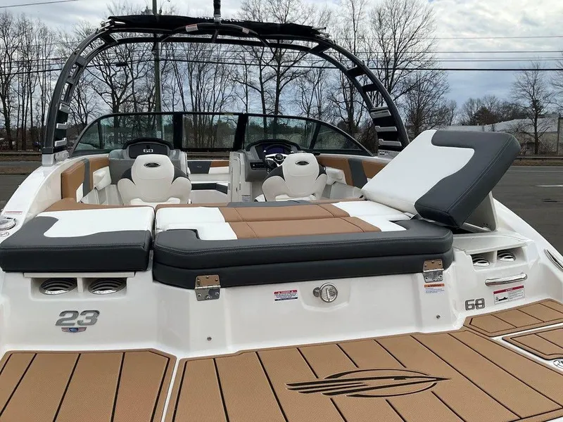 Slide: The Image of 2025 Chaparral 23 SSi boat with stylish seating and sleek design. - 9