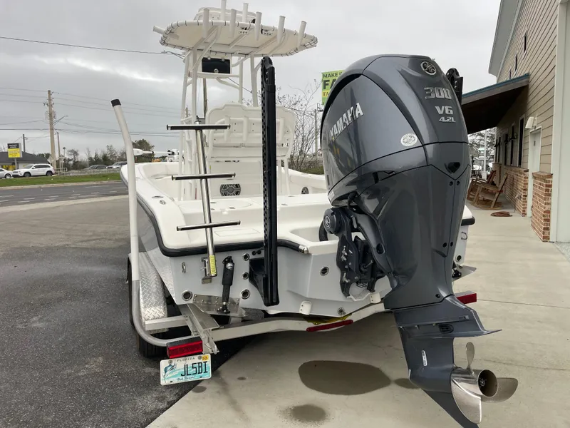 Slide: The Image of 2022 Clark Sound 24 boat with Yamaha V6 engine on a trailer. - 2