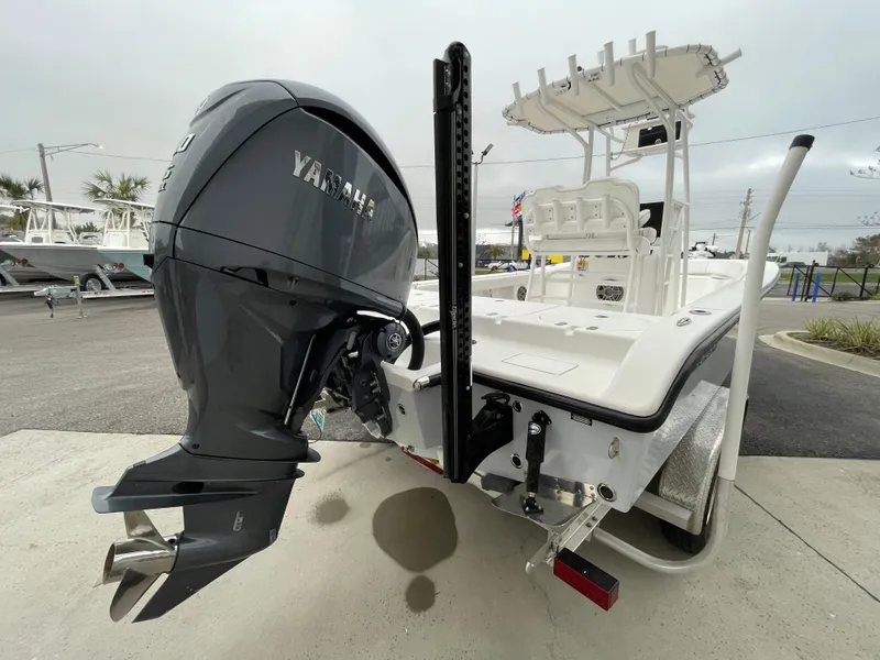 Slide: The Image of 2022 Clark Sound 24 boat with Yamaha outboard motor, docked on a trailer. - 3