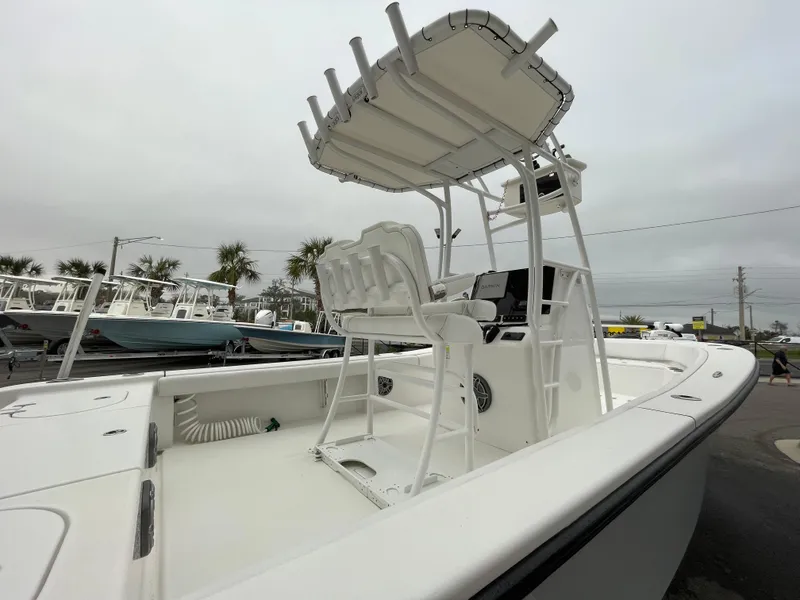 Slide: The Image of 2022 Clark Sound 24 boat with T-top and seating, displayed outdoors. - 4