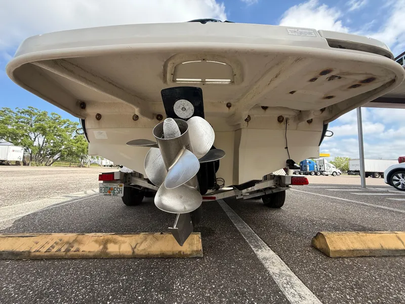 Slide: The Image of Rear view of a 2008 Sea Ray 210 Sundeck boat with dual propellers. - 23