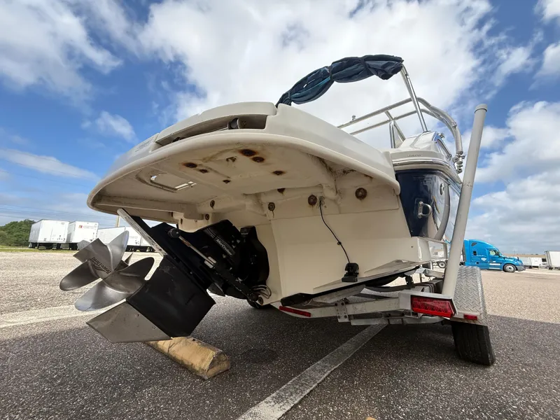 Slide: The Image of 2008 Sea Ray 210 Sundeck boat on trailer, rear view, cloudy sky background. - 25