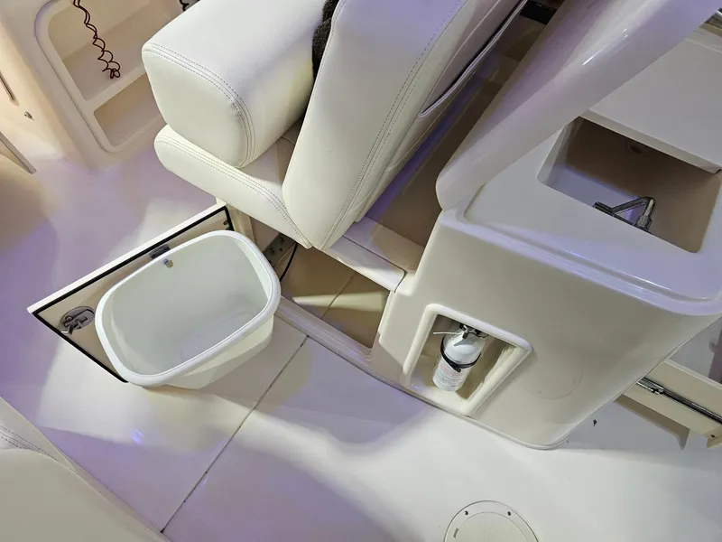 Slide: The Image of Interior of 2015 Grady-White Freedom 275 boat with seating and storage compartments. - 13