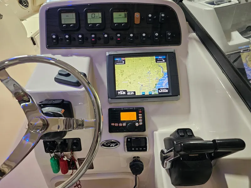 Slide: The Image of Control panel of 2015 Grady-White Freedom 275 boat with navigation system. - 6