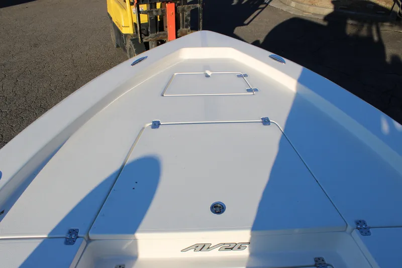 Slide: The Image of Bow of 2025 Avenger AV26 boat with storage compartments and sleek design. - 11