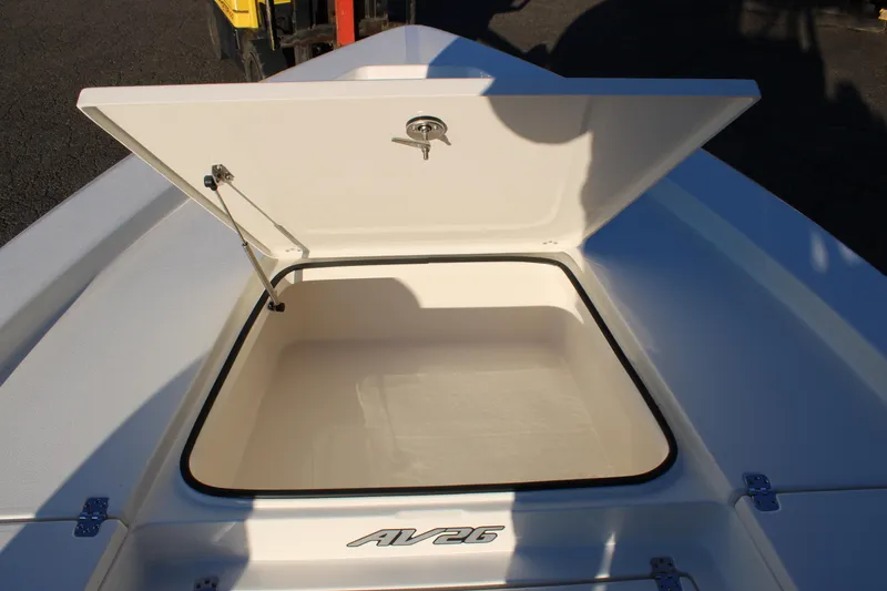 Slide: The Image of Open storage compartment on 2025 Avenger AV26 boat. - 12