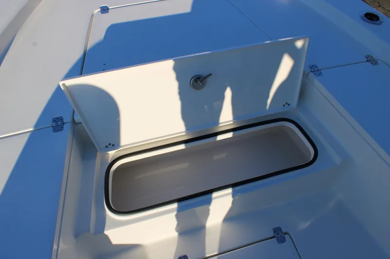 Slide: The Image of Open storage compartment on 2025 Avenger AV26 boat deck. - 15