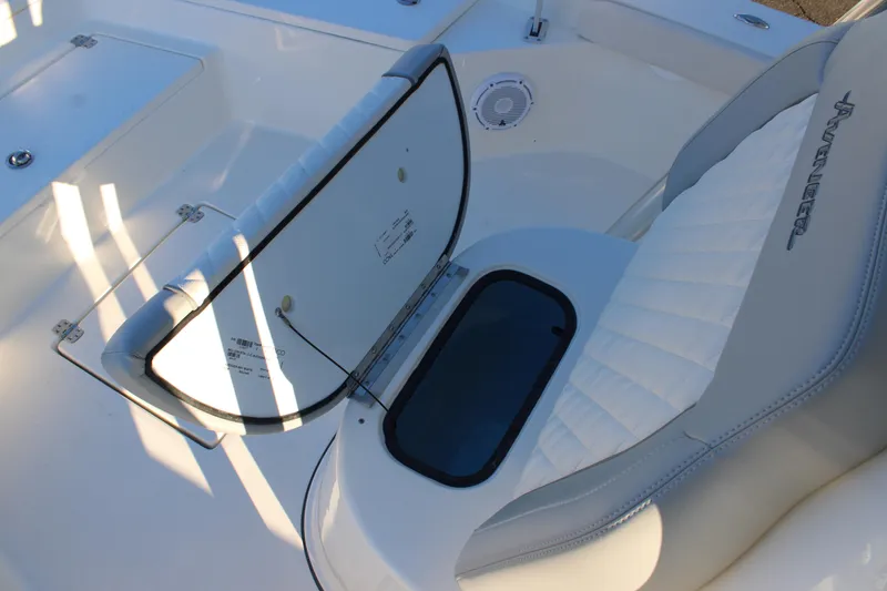 Slide: The Image of 2025 Avenger AV26 boat interior with white seating and storage compartment. - 18