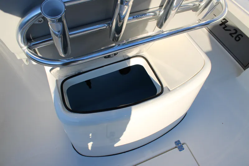 Slide: The Image of Avenger AV26 2025 boat interior with rod holders and storage compartment. - 22