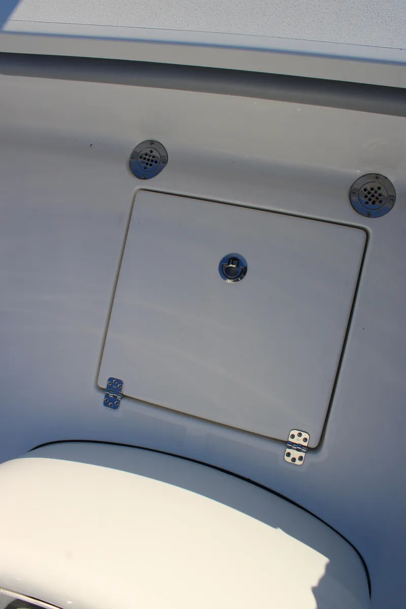 Slide: The Image of Avenger AV26 2025 boat interior with storage compartment and ventilation grilles. - 23