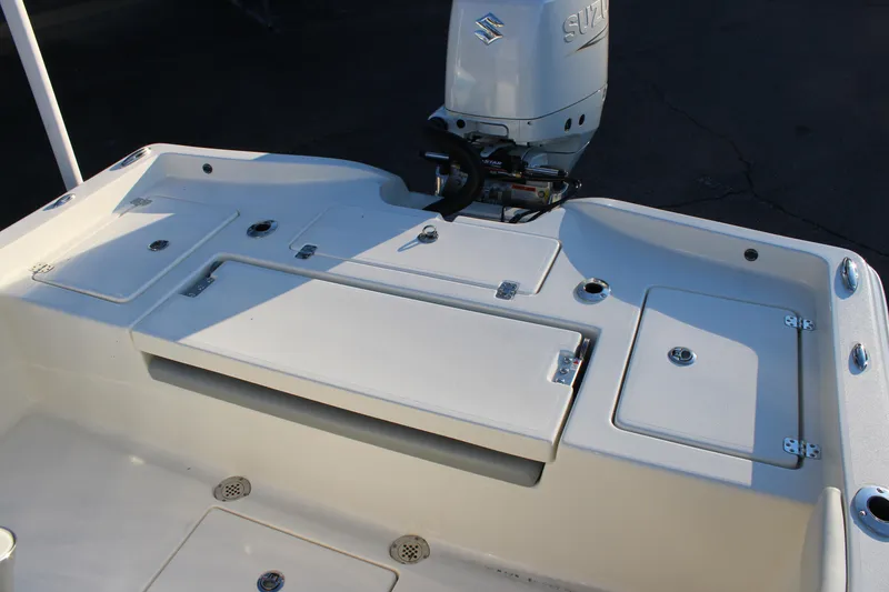 Slide: The Image of 2025 Avenger AV26 boat deck with Suzuki outboard motor. - 24