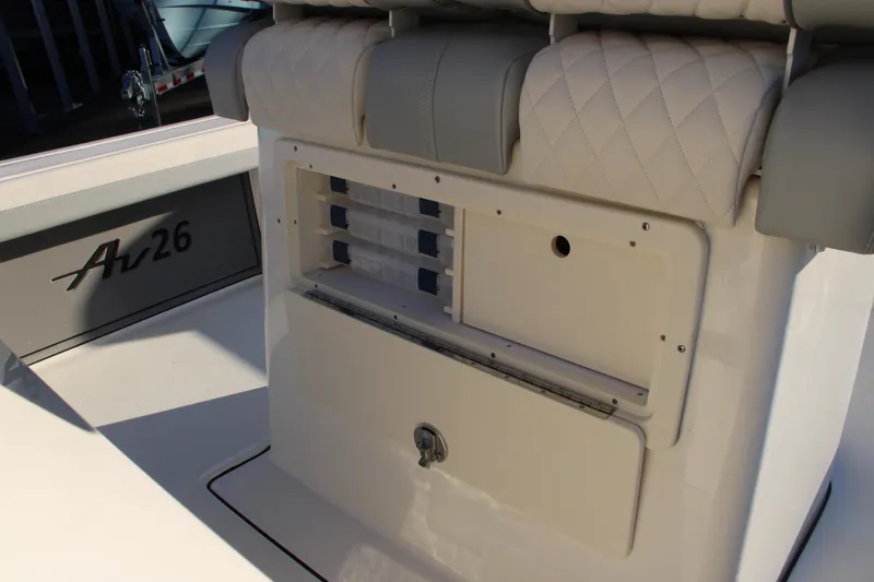 Slide: The Image of Avenger AV26 2025 boat interior with storage compartment and seating. - 7