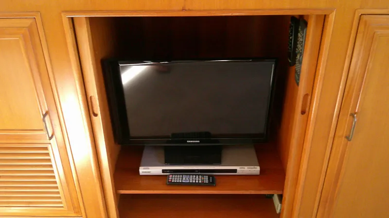 Slide: The Image of Entertainment center with TV and DVD player on 1996 Ocean Alexander 546 Yachtfisher. - 26