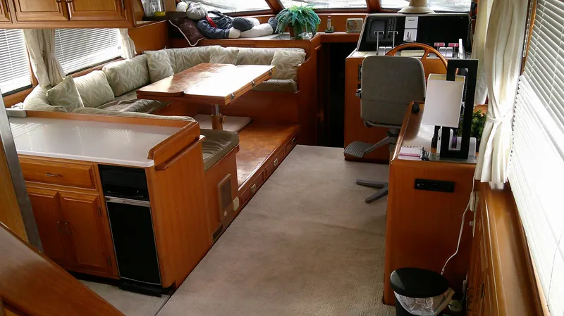 Slide: The Image of Interior of 1996 Ocean Alexander 546 Yachtfisher with cozy seating and helm station. - 39