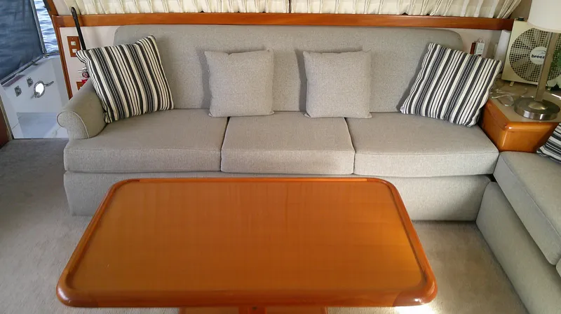 Slide: The Image of Interior of 1996 Ocean Alexander 546 Yachtfisher with sofa and wooden table. - 4