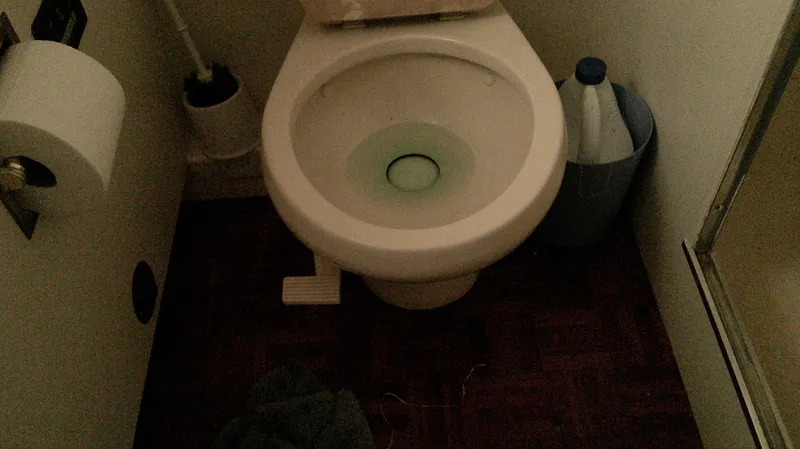 Slide: The Image of Toilet area on 1996 Ocean Alexander 546 Yachtfisher with cleaning supplies. - 47