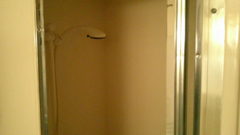 Slide: The Image of Shower area inside 1996 Ocean Alexander 546 Yachtfisher, featuring a simple design. - 48