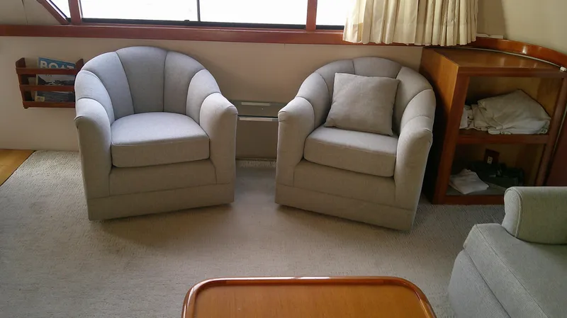 Slide: The Image of Interior of 1996 Ocean Alexander 546 Yachtfisher with two gray armchairs. - 6