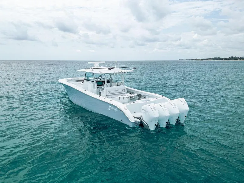 The Image of 2019 Yellowfin 42 boat with triple outboard engines on open sea. - 0