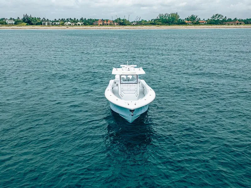 Slide: The Image of Aerial view of 2019 Yellowfin 42 boat on calm ocean near shoreline. - 10