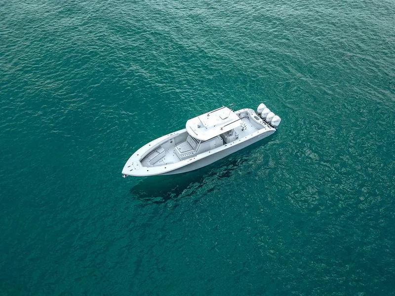 Slide: The Image of 2019 Yellowfin 42 boat on clear blue water, aerial view. - 11